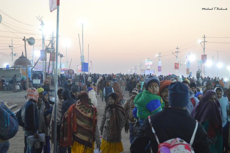 Pilgrims at sunrise at the Prayagraj Kumbh Mela